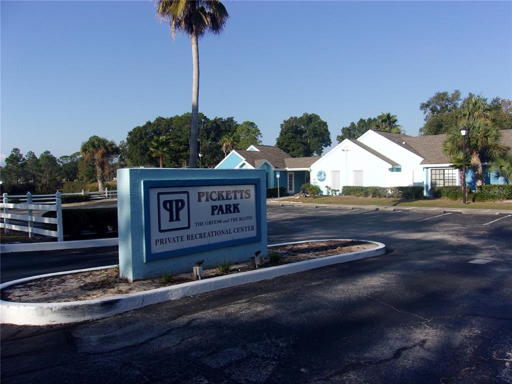 9410 Nakoma Way, Unit H Weeki Wachee, FL 34613 - Photo 4 of 29 a view of a street sign
