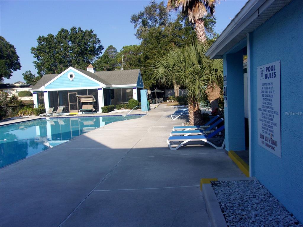 9410 Nakoma Way, Unit H Weeki Wachee, FL 34613 - Photo 7 of 29 a view of a house with a patio