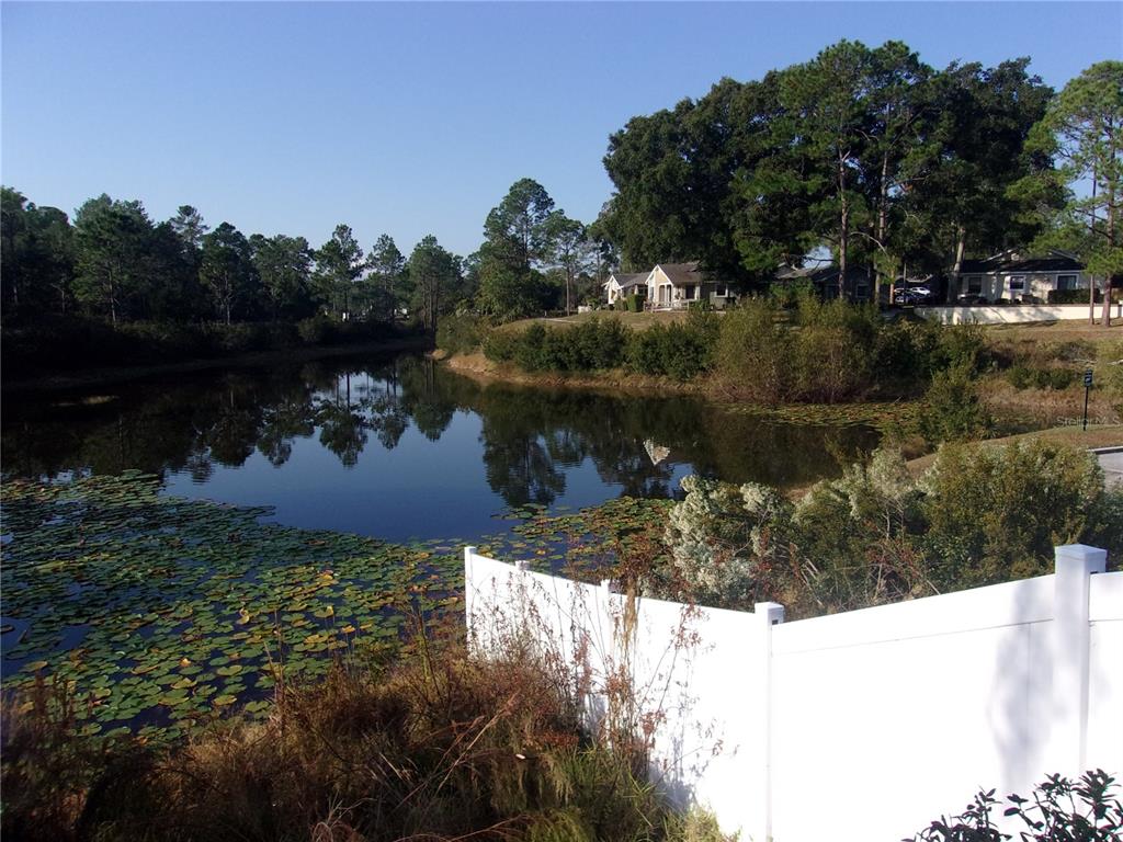 9410 Nakoma Way, Unit H Weeki Wachee, FL 34613 - Photo 9 of 29 a view of a lake