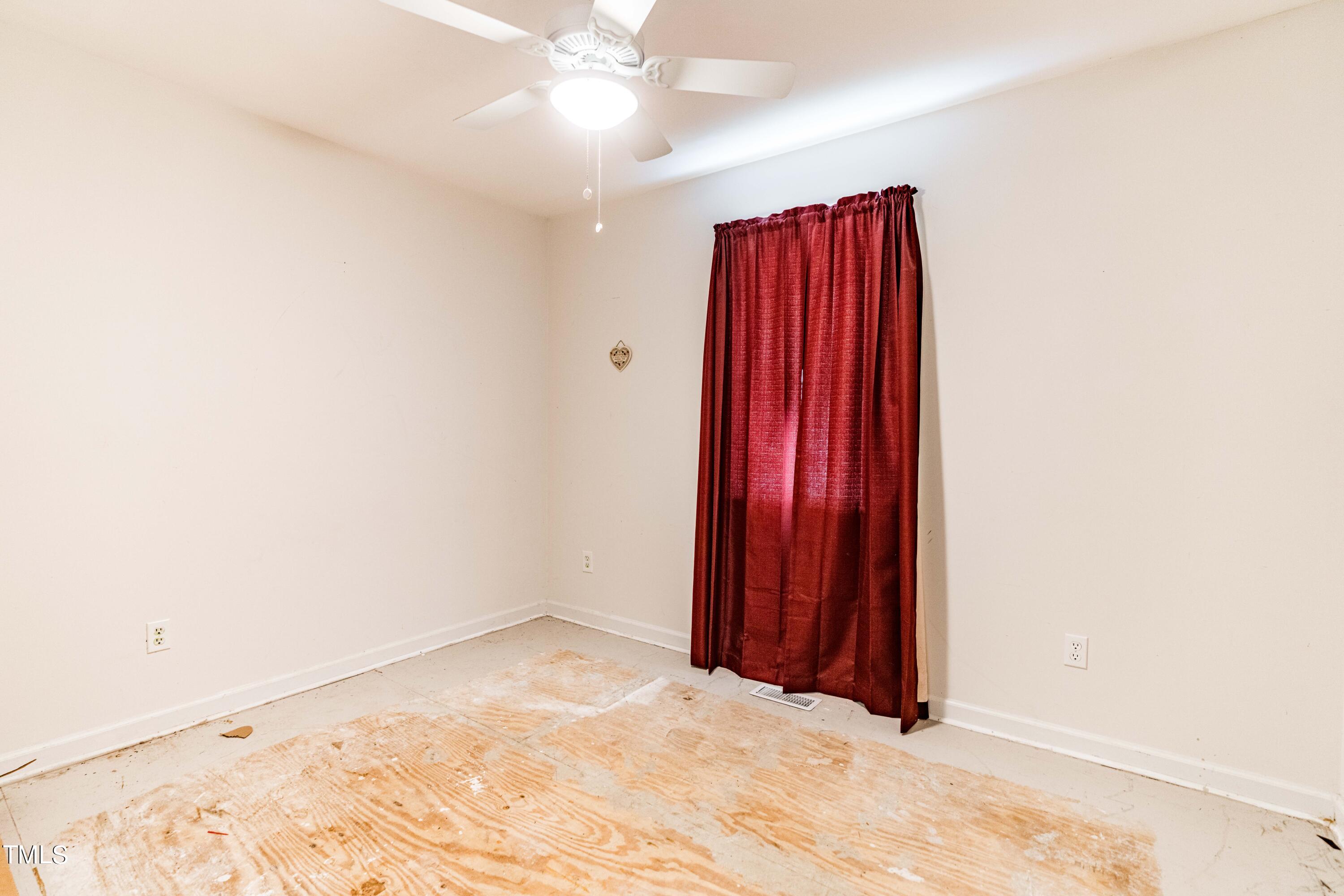 3417 Leonard Road Raleigh, NC 27610 - Photo 14 of 26 an empty room with windows and closet