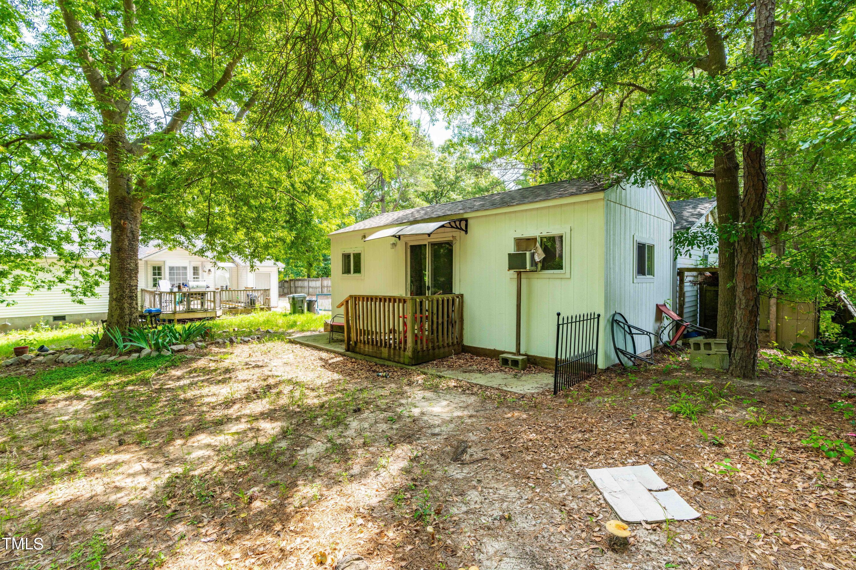 3417 Leonard Road Raleigh, NC 27610 - Photo 23 of 26 a view of a backyard with a tree
