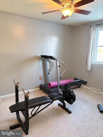a bedroom with furniture and air hockey table