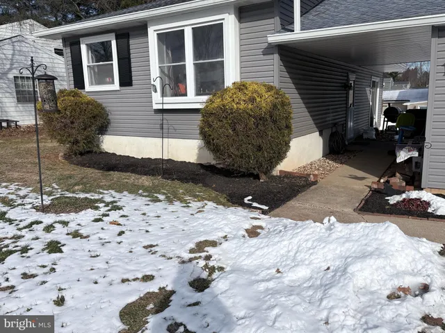 a view of a backyard with table and chairs and ice snow