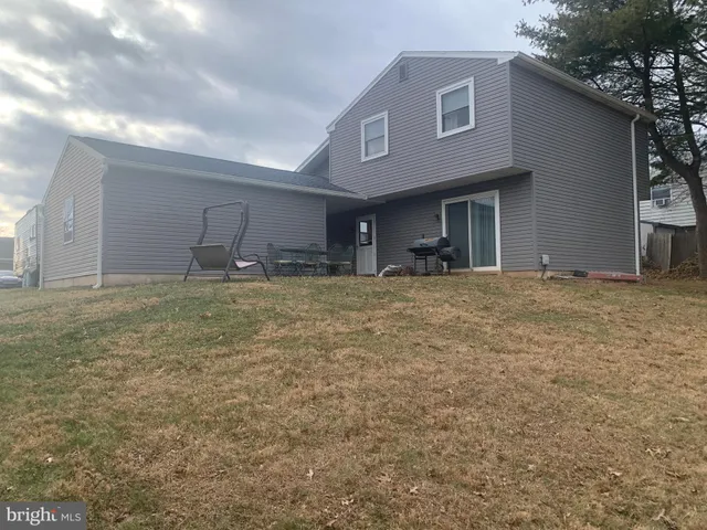 a view of an empty room with yard and garage