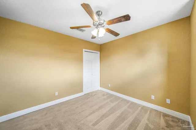 a view of a big room with windows