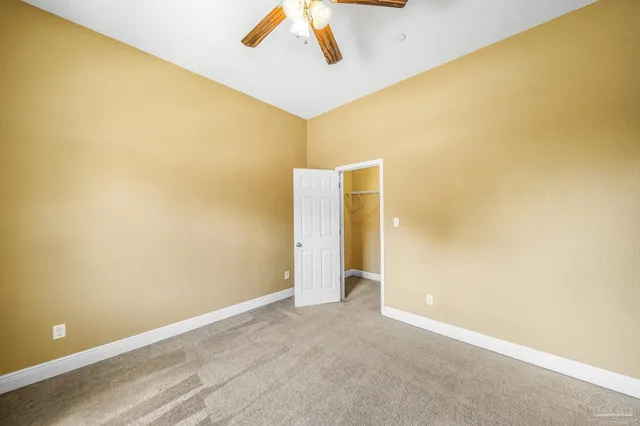 a view of a big room with wooden walls