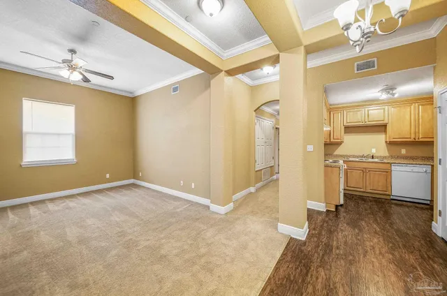a view of a kitchen with a stove cabinets and wooden floor