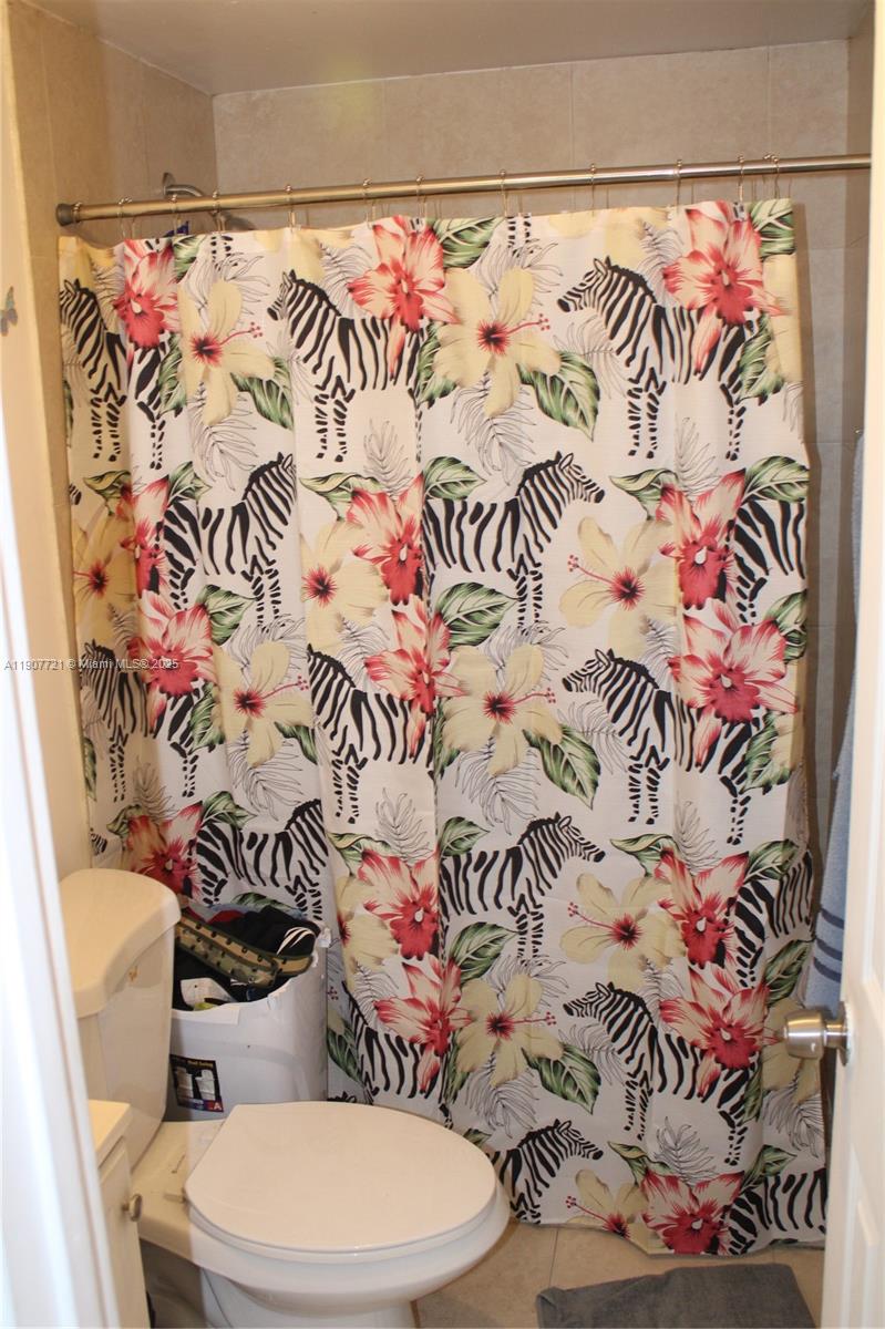 12841 Southwest 12th Terrace Miami, FL 33184 - Photo 14 of 16 a bathroom with a toilet and a sink