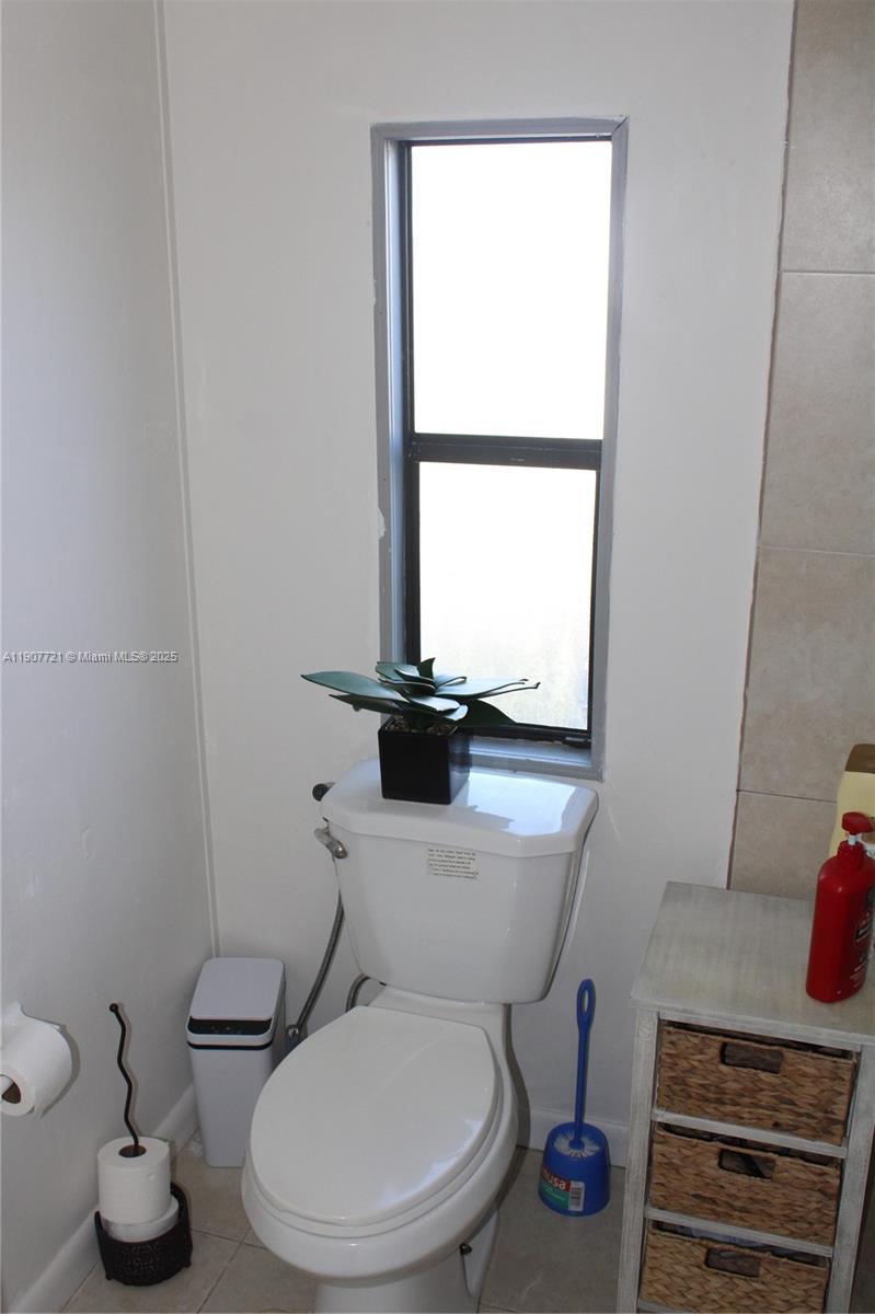 12841 Southwest 12th Terrace Miami, FL 33184 - Photo 15 of 16 a bathroom with a toilet and a mirror
