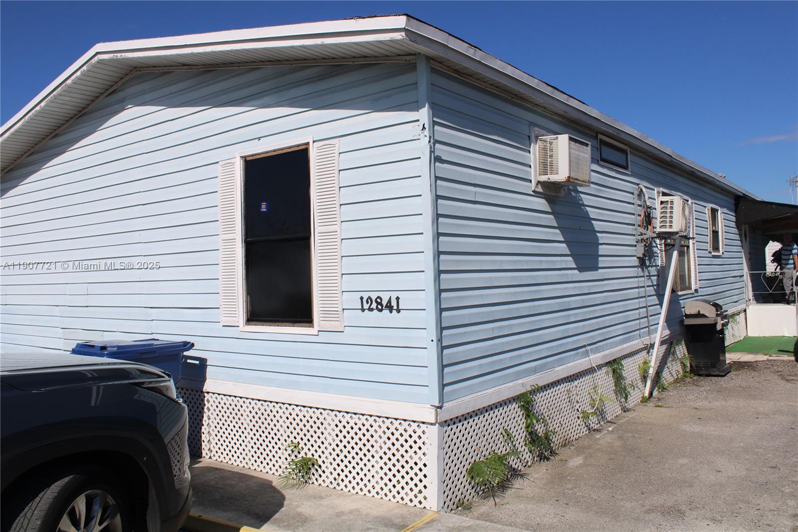 12841 Southwest 12th Terrace Miami, FL 33184 - Photo 5 of 16 a view of a house with a balcony