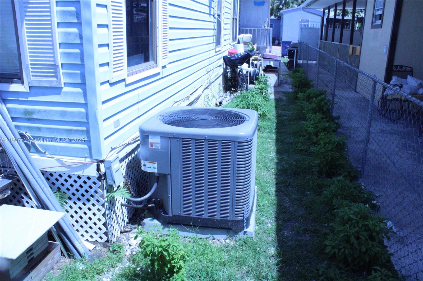 12841 Southwest 12th Terrace Miami, FL 33184 - Photo 6 of 16 a view of an outdoor sitting area with brick walls