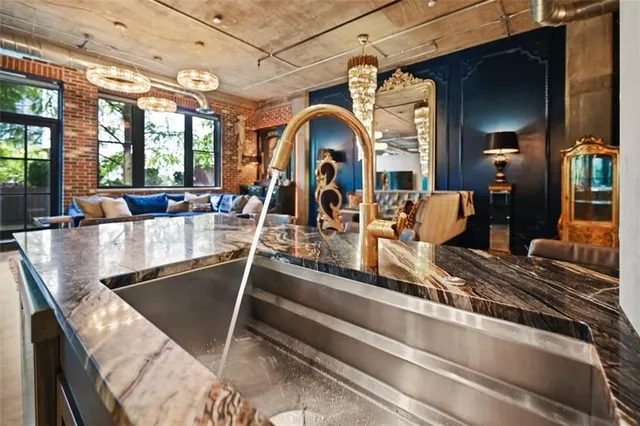 a view of walk in closet with wooden floor