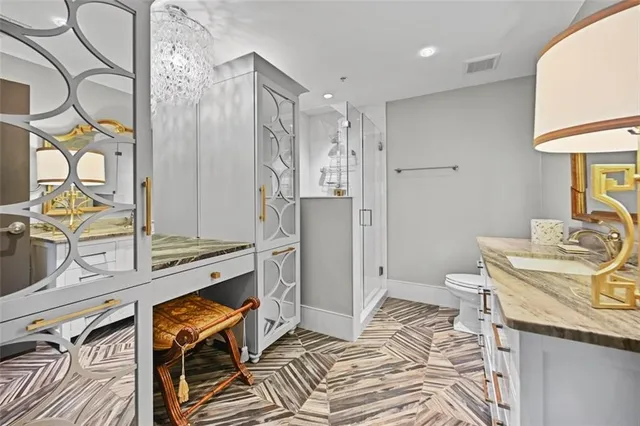 a bedroom with bed and wall paintings