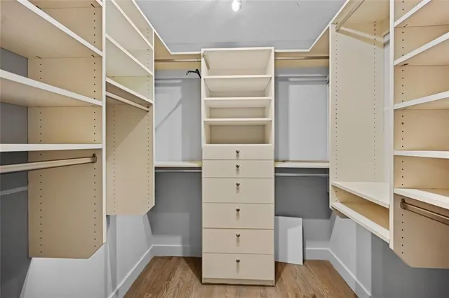 a living room with lots of furniture and a chandelier