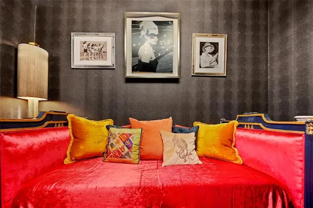 a view of a patio with a dining table and chairs with wooden floor