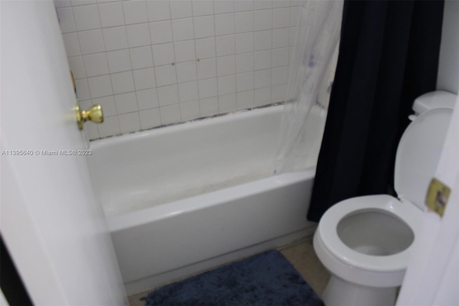 13475 Southwest 62nd Street, Unit 5 Miami, FL 33183 - Photo 17 of 32 a bathroom with a sink and toilet