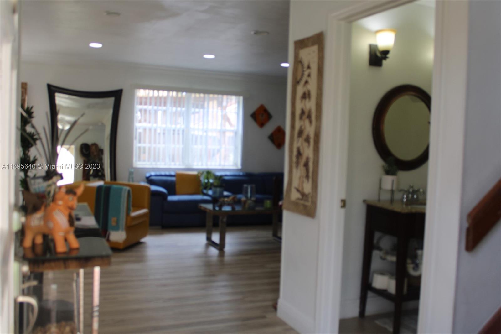 13475 Southwest 62nd Street, Unit 5 Miami, FL 33183 - Photo 20 of 32 a living room with furniture and a fireplace