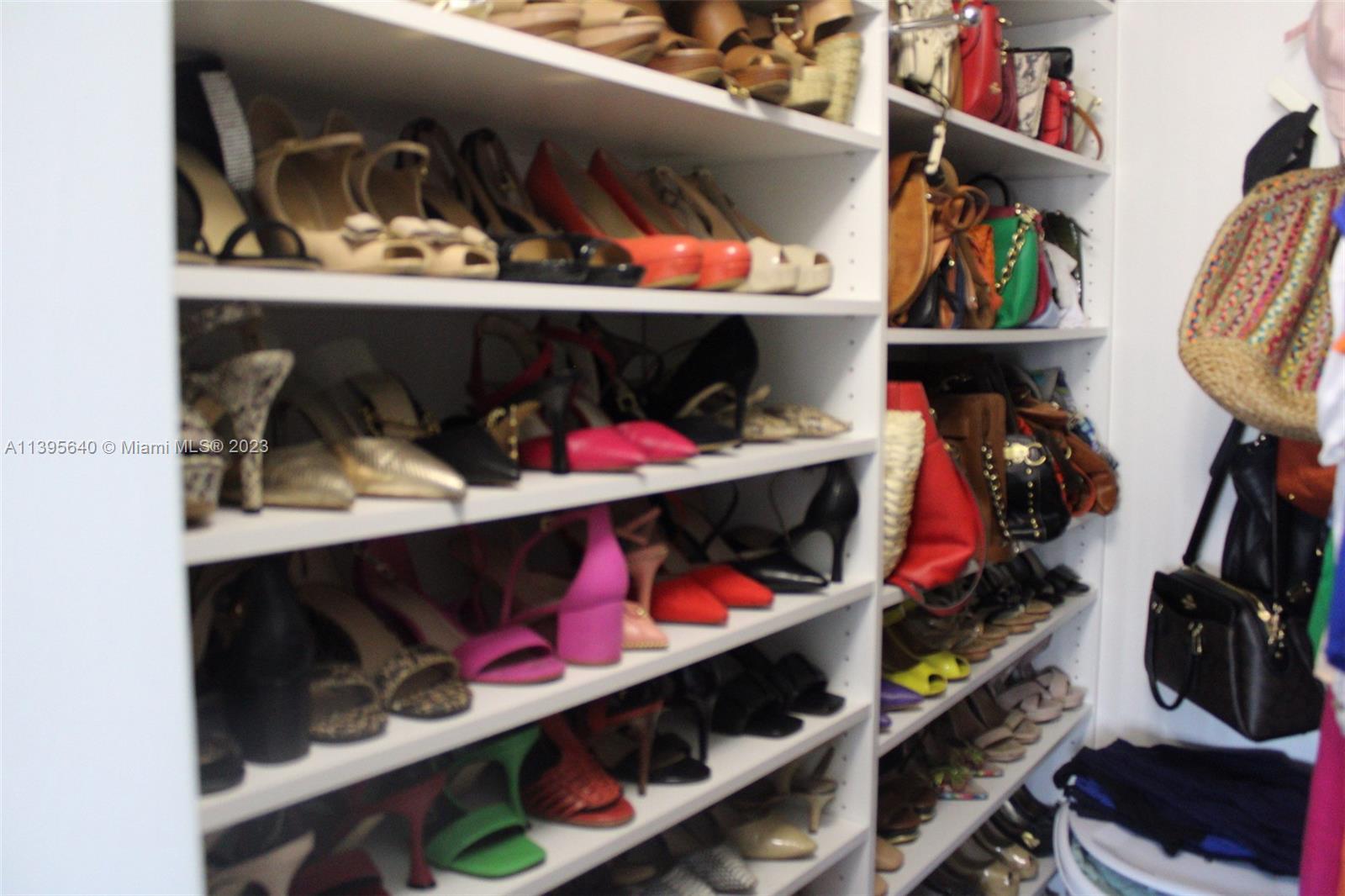 13475 Southwest 62nd Street, Unit 5 Miami, FL 33183 - Photo 28 of 32 a view of walk in closet with clothes and shoes