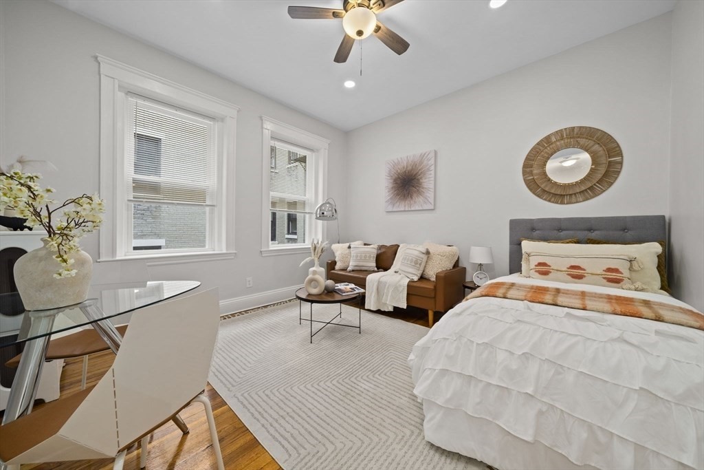 1564 Commonwealth Avenue, Unit 3 Boston, MA 02135 - Photo 1 of 9 a bedroom with bed and window