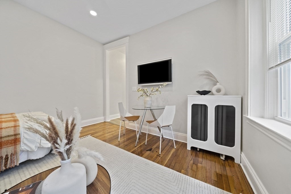 1564 Commonwealth Avenue, Unit 3 Boston, MA 02135 - Photo 3 of 9 a view of a livingroom with furniture and a flat screen tv