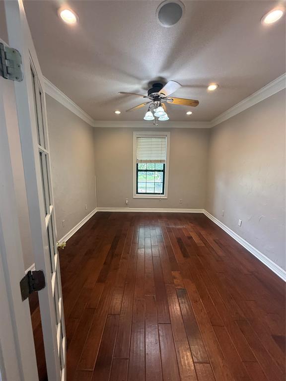201 Woodhaven Drive Minden, LA 71055 - Photo 7 of 31 Room featuring wood-finish flooring, a ceiling fan with integrated lighting, recessed lighting, crown molding, and a single window with blinds