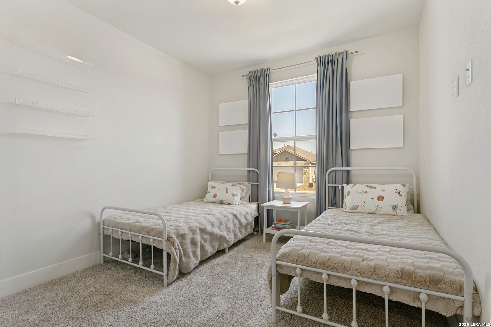 7350 Walkers Loop Live Oak, TX 78233 - Photo 12 of 23 a bedroom with two beds and a window