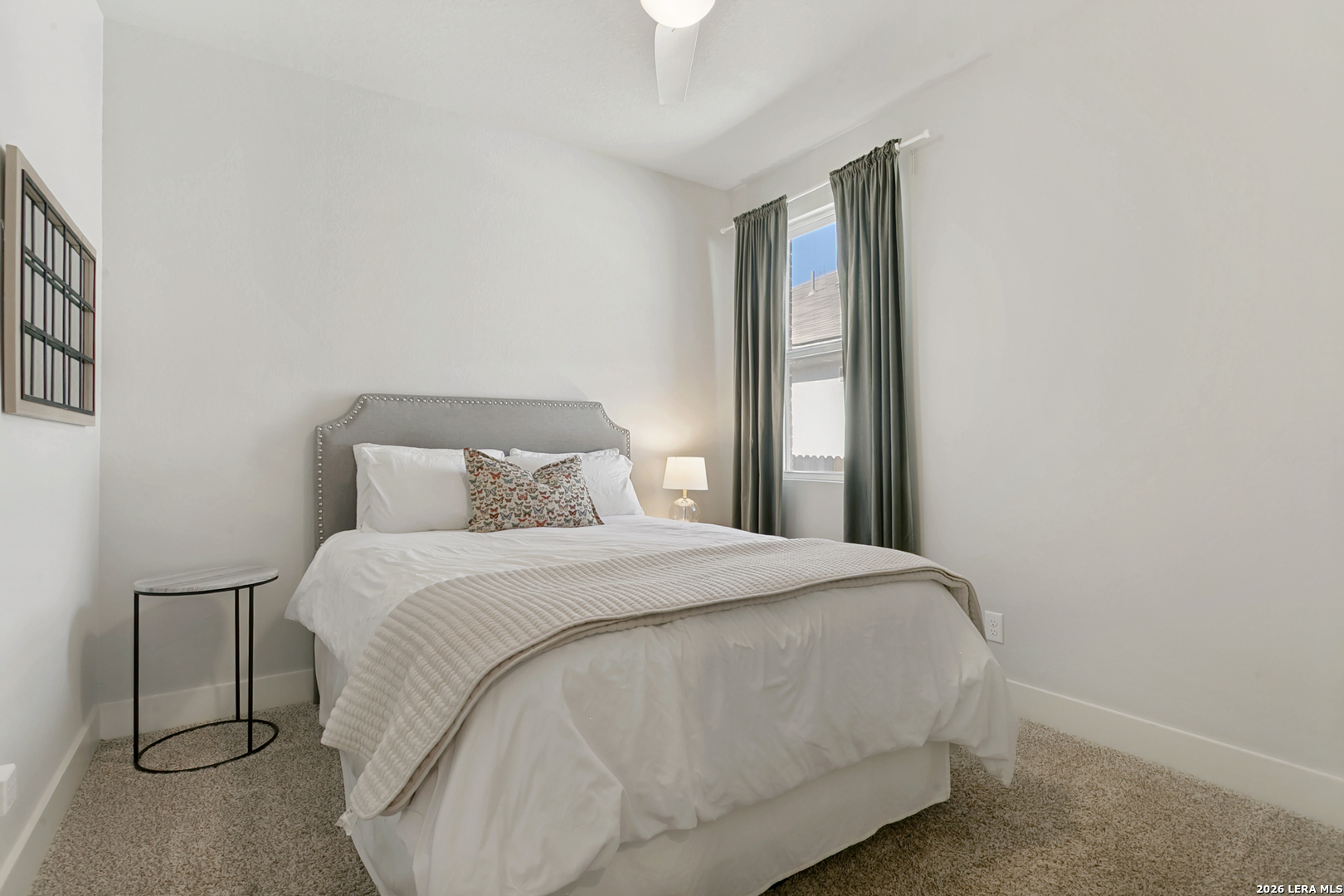 7350 Walkers Loop Live Oak, TX 78233 - Photo 14 of 23 a bedroom with a bed and a window