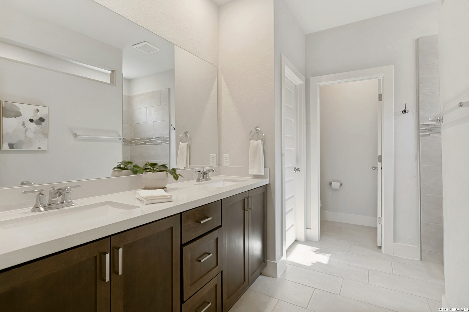7350 Walkers Loop Live Oak, TX 78233 - Photo 17 of 23 a spacious bathroom with a double vanity sink mirror and double