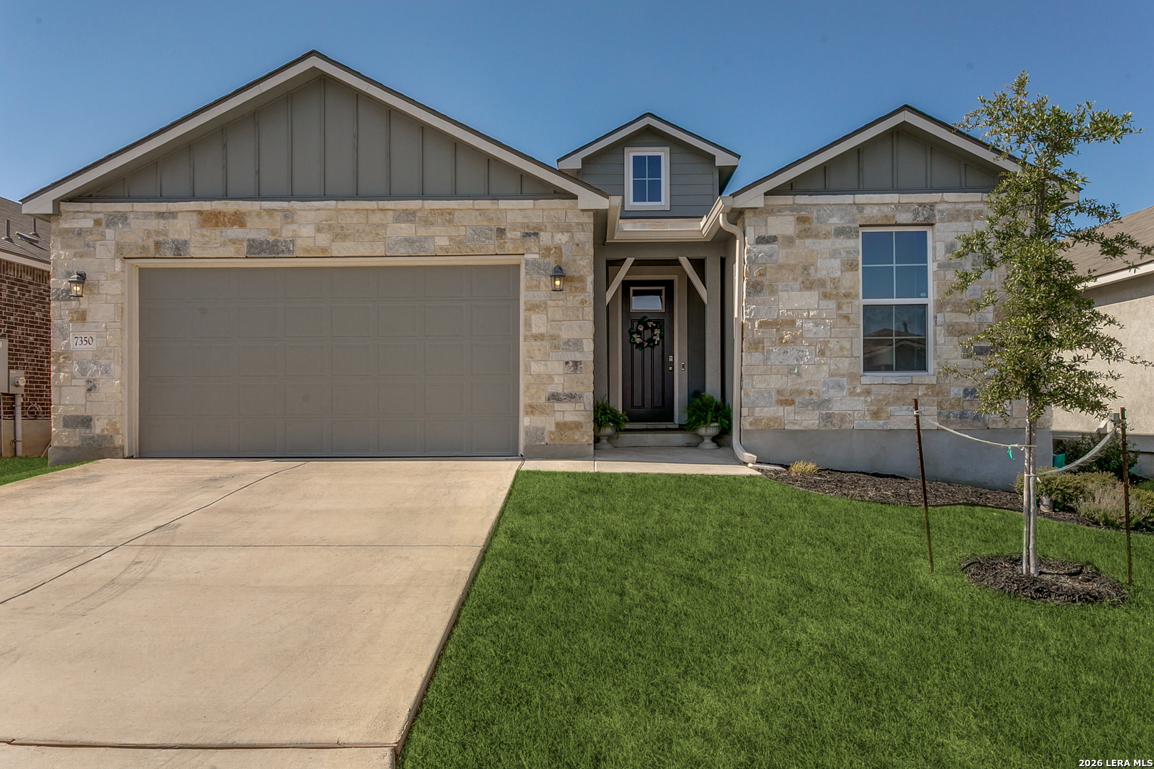 7350 Walkers Loop Live Oak, TX 78233 - Photo 2 of 23 a front view of a house with a yard