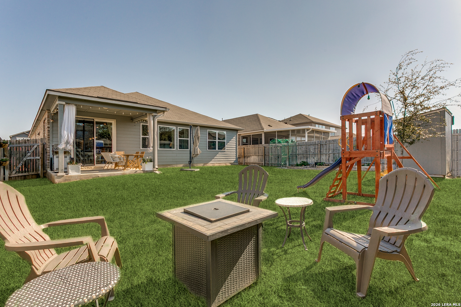 7350 Walkers Loop Live Oak, TX 78233 - Photo 21 of 23 a view of a chair and table in backyard of the house