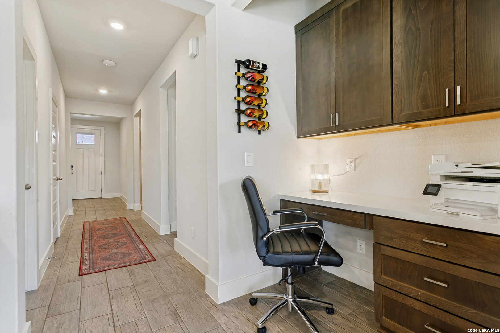 7350 Walkers Loop Live Oak, TX 78233 - Photo 4 of 23 a view of a workspace with furniture and wooden floor