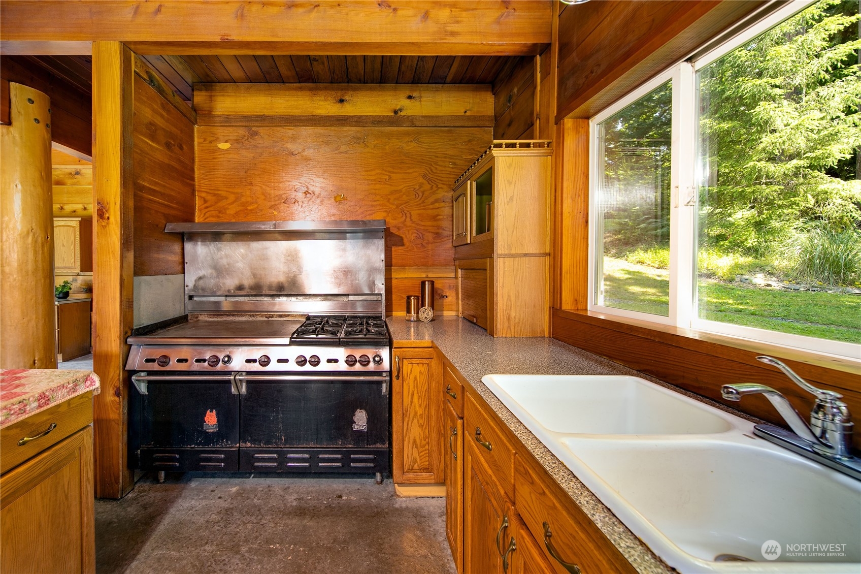 832 Lakenes Road Quilcene, WA 98376 - Photo 8 of 38 a kitchen with a stove and a sink
