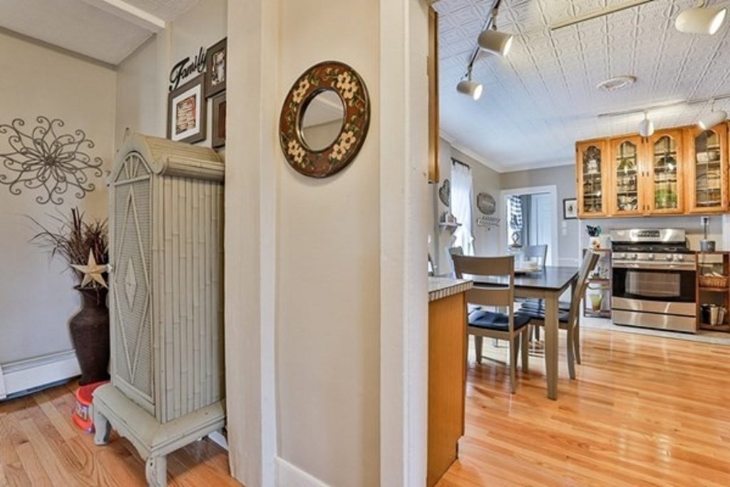 50 Mission Road Tyngsborough, MA 01879 - Photo 11 of 41 a view of a dining room with furniture and wooden floor