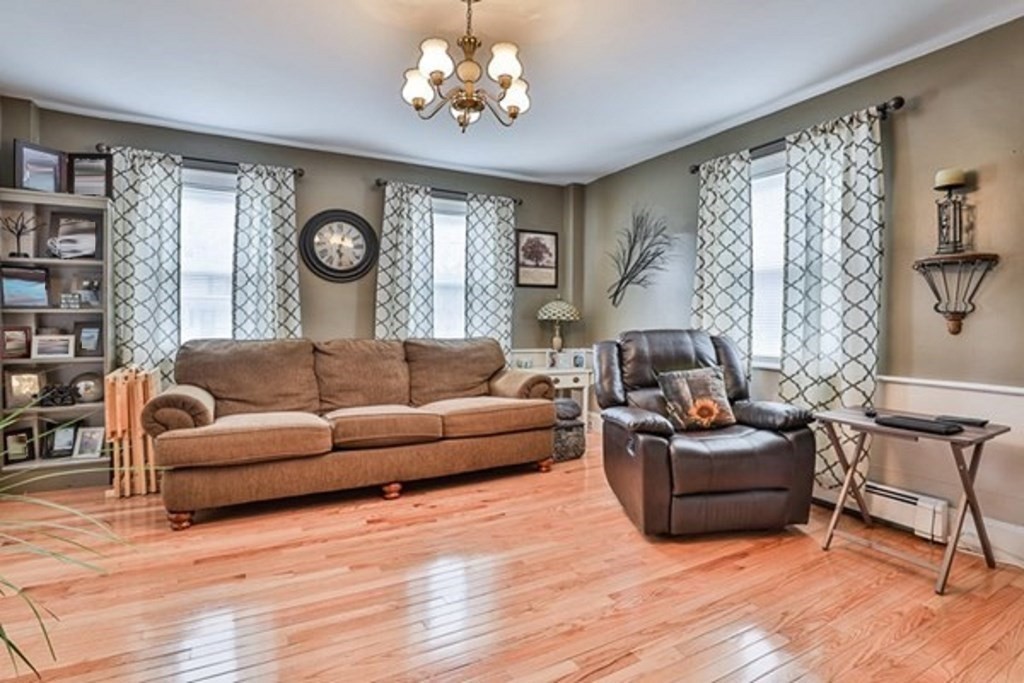 50 Mission Road Tyngsborough, MA 01879 - Photo 12 of 41 a living room with furniture and a large window
