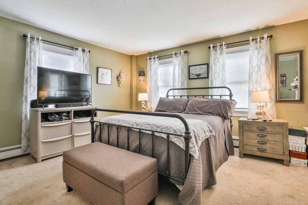 50 Mission Road Tyngsborough, MA 01879 - Photo 15 of 41 a bedroom with a bed and a flat screen television