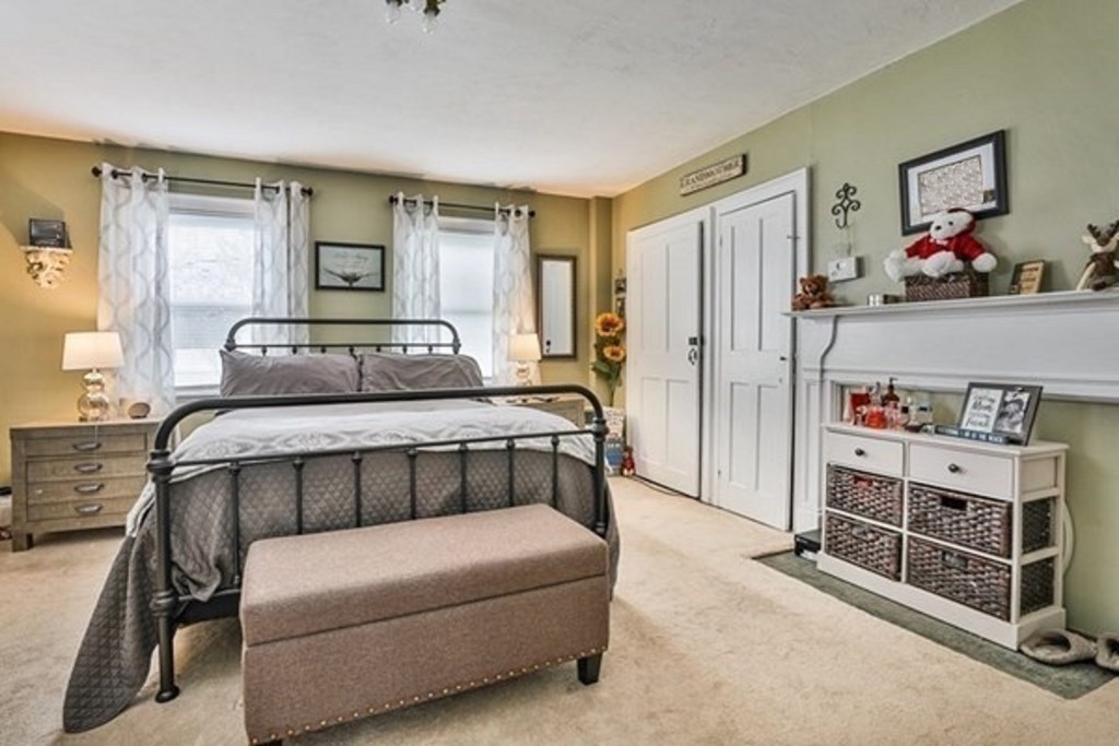 50 Mission Road Tyngsborough, MA 01879 - Photo 16 of 41 a bedroom with furniture and a dresser