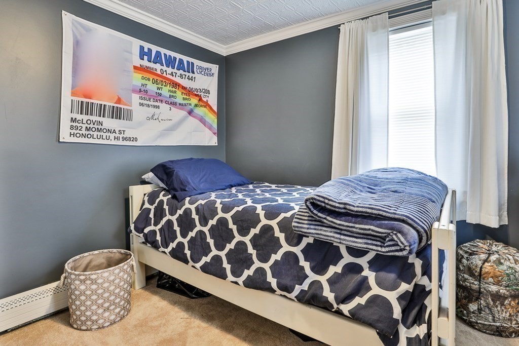 50 Mission Road Tyngsborough, MA 01879 - Photo 19 of 41 a bedroom with a bed and a window