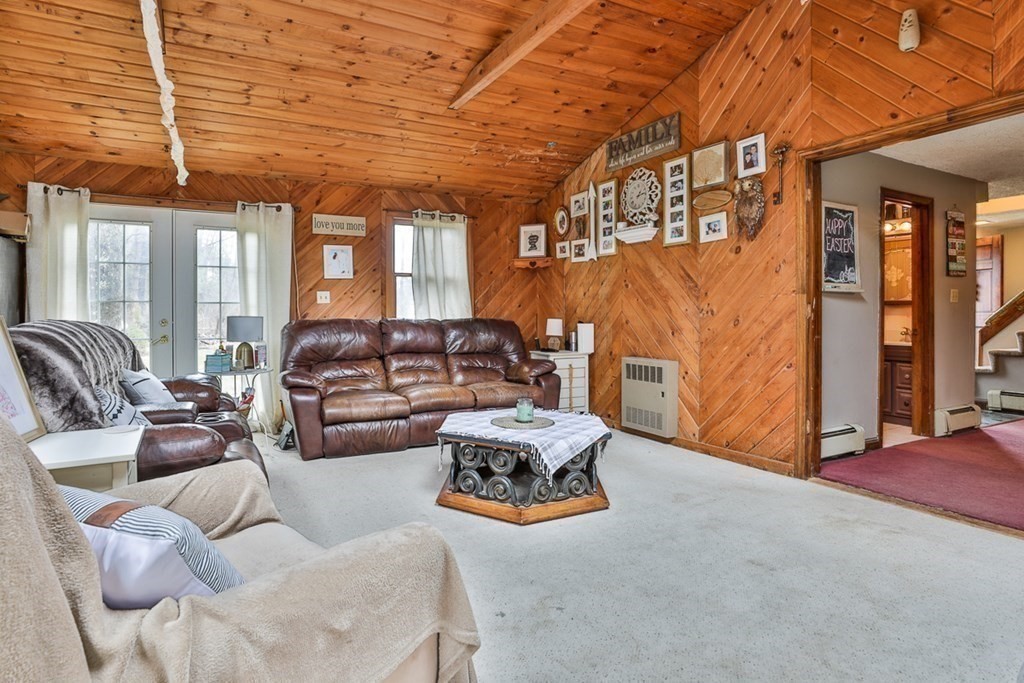 50 Mission Road Tyngsborough, MA 01879 - Photo 27 of 41 a living room with furniture and a chandelier
