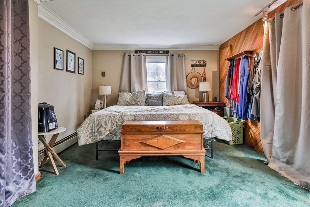 50 Mission Road Tyngsborough, MA 01879 - Photo 28 of 41 a bed sitting in a room next to a window