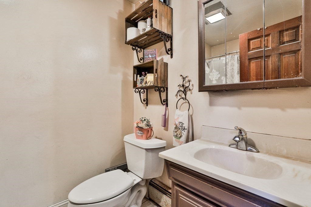 50 Mission Road Tyngsborough, MA 01879 - Photo 30 of 41 a bathroom with a sink a toilet and shower