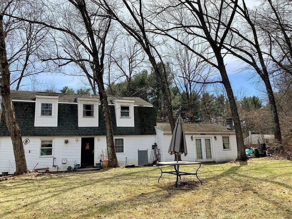 50 Mission Road Tyngsborough, MA 01879 - Photo 35 of 41 a house with trees in front of it