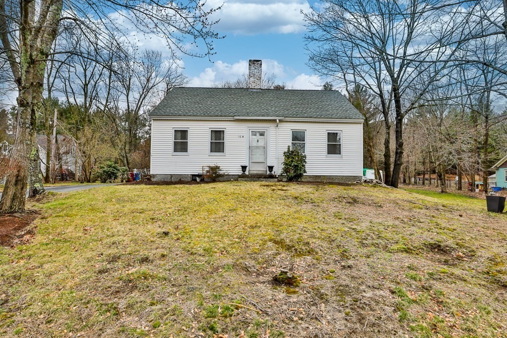 50 Mission Road Tyngsborough, MA 01879 - Photo 4 of 41 a view of a house with a yard covered with snow