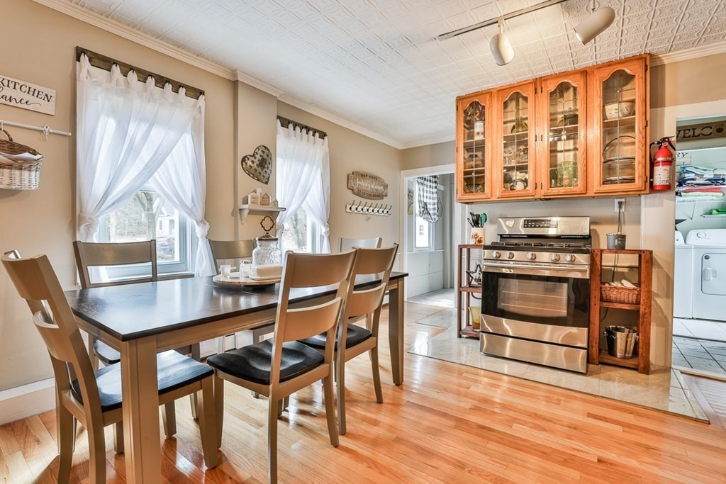 50 Mission Road Tyngsborough, MA 01879 - Photo 7 of 41 a dining room with furniture and wooden floor