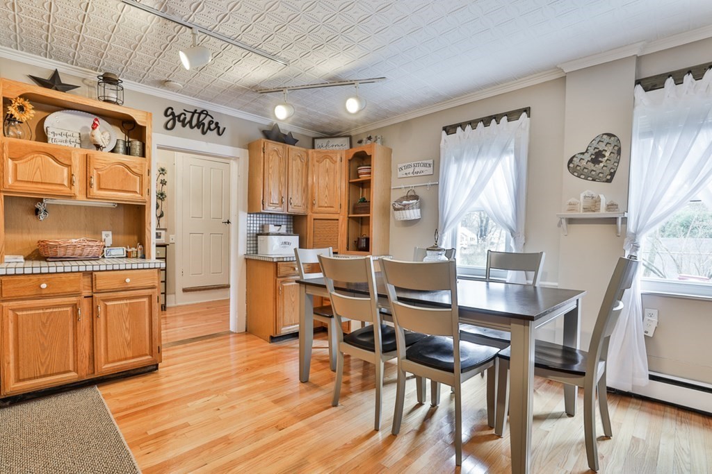 50 Mission Road Tyngsborough, MA 01879 - Photo 9 of 41 a view of a dining room with furniture and wooden floor