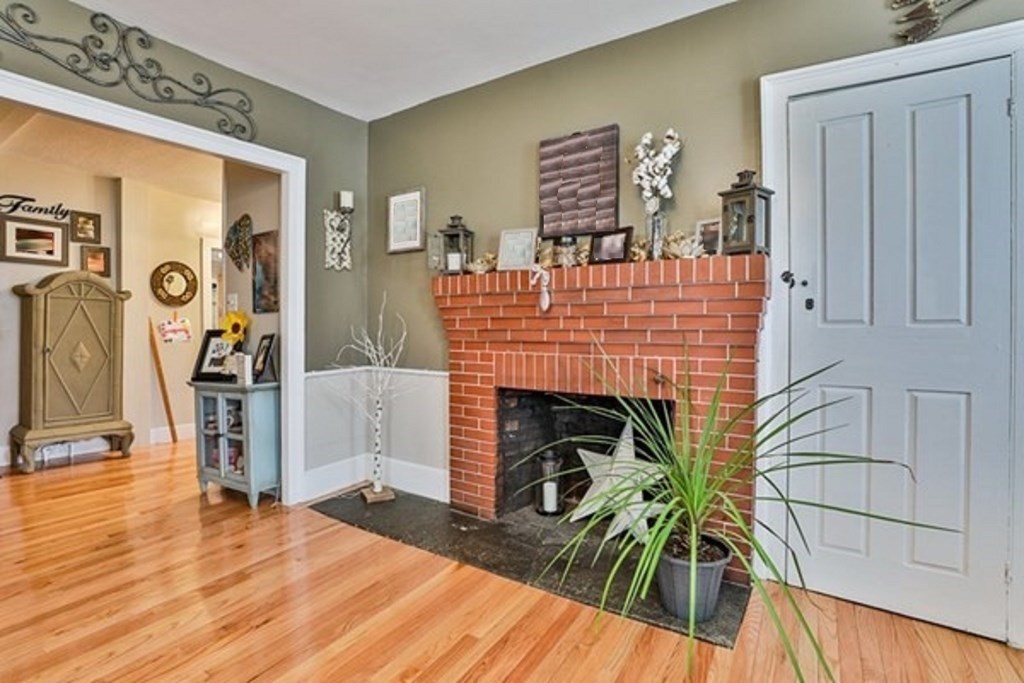 50 Mission Road Tyngsborough, MA 01879 - Photo 10 of 41 a living room with furniture and a fireplace