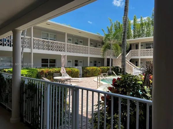 a front view of house with deck and outdoor seating