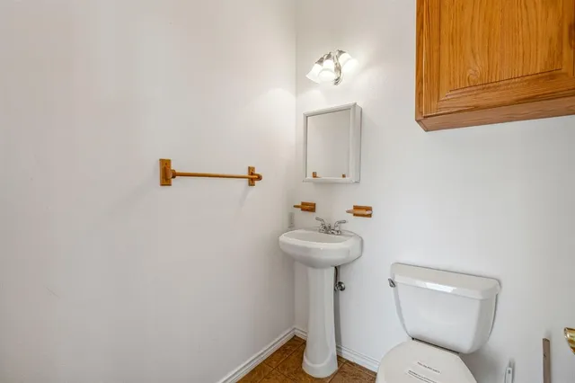 a bathroom with a sink and toilet