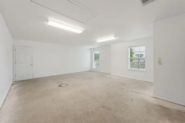 an empty room with windows