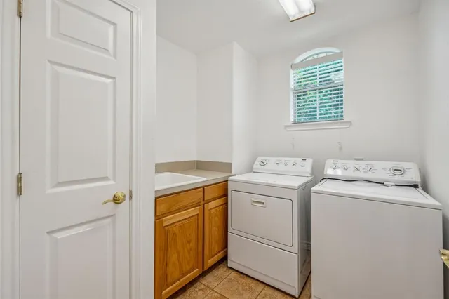 a view of storage and utility room with washer and dryer