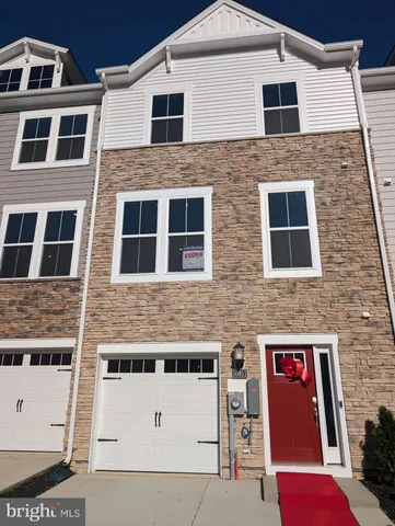 a front view of a building with large windows